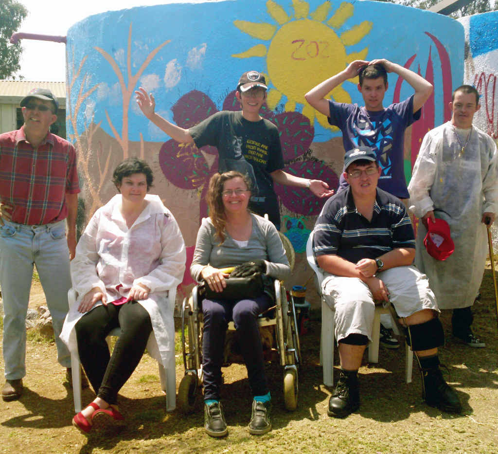Members of Emerald’s Semita House stand in front of their completed rainwater tank mural. Members of Emerald’s Semita House stand in front of their completed rainwater tank mural.